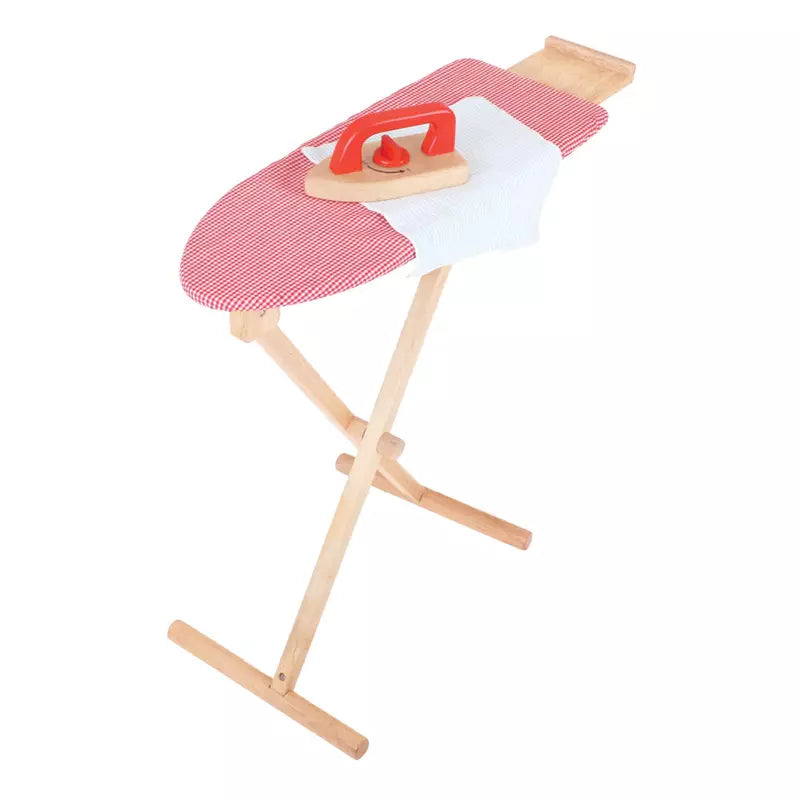 A Bigjigs red and white ironing board with an iron on it.