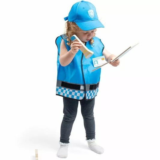 A little girl dressed up as a Bigjigs Police Dress Up Set police officer.
