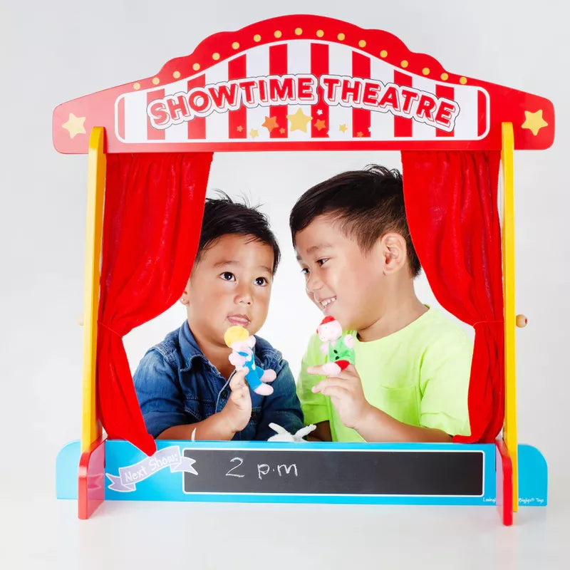 Two children in front of a Bigjigs Table Top Theatre.