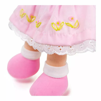 A close up of Bigjigs Rose Doll Small's feet wearing pink shoes.