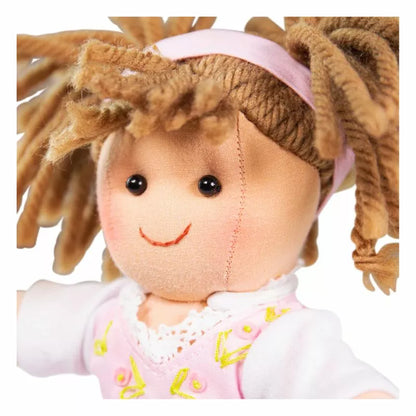 A Bigjigs Rose Doll Small with blonde hair and a pink shirt.