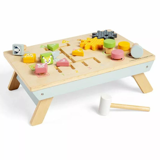 A Bigjigs Tabletop Activity Bench with blocks and a hammer to develop fine motor skills and co-ordination.