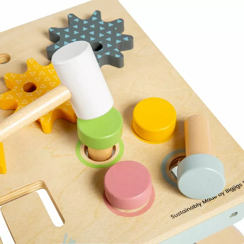 A Bigjigs Tabletop Activity Bench with colorful pieces and a hammer that promotes co-ordination and fine motor skills.