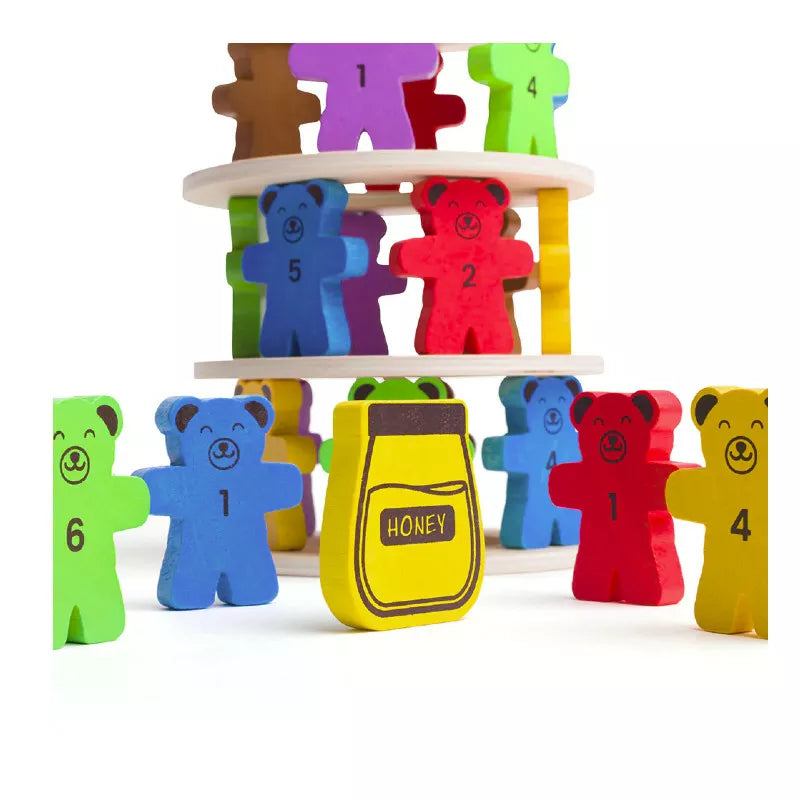 A group of Bigjigs Tumbling Teddies Balance Game wooden bears standing next to each other.