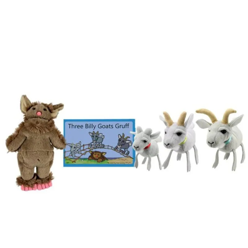 Plush toys and finger puppets from The Puppet Company Finger Puppet Story Set Three Billy Goats Gruff are displayed, including a brown troll on the left and three white goats of varying sizes. A blue storybook with an illustrated cover is in the background, perfect for storytelling sessions.