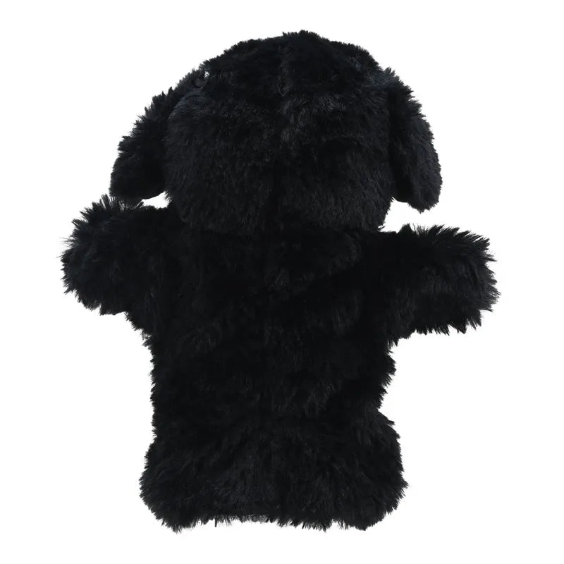 A fluffy black ECO Puppet Buddies Border Collie Hand Puppet made from recycled materials, shown from the back with visible ears and limbs, against a plain white background.