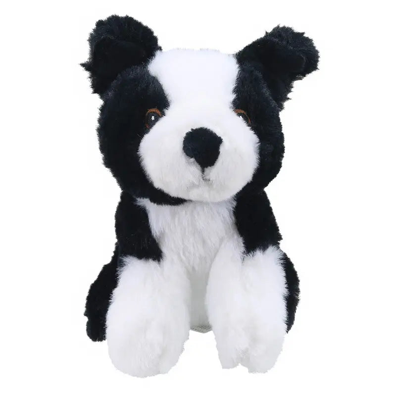 The Wilberry Eco Mini Border Collie is a black and white plush toy with upright ears, round brown eyes, and a soft, fluffy texture. Seated facing forward, it is crafted from eco-friendly recycled materials.