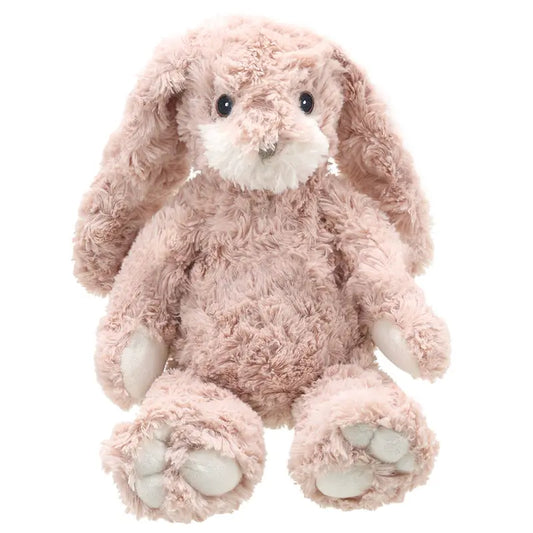 The Wilberry Classic Pink Bunny is a soft, eco-friendly stuffed toy made from recycled materials, featuring light pink plush, long floppy ears, a white snout and paws, and an upright sitting posture.