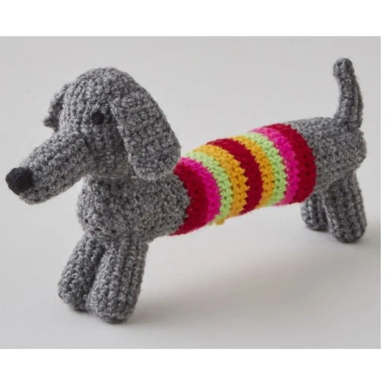 A Buttonbag Crochet a Sausage Dog with a colorful sweater.