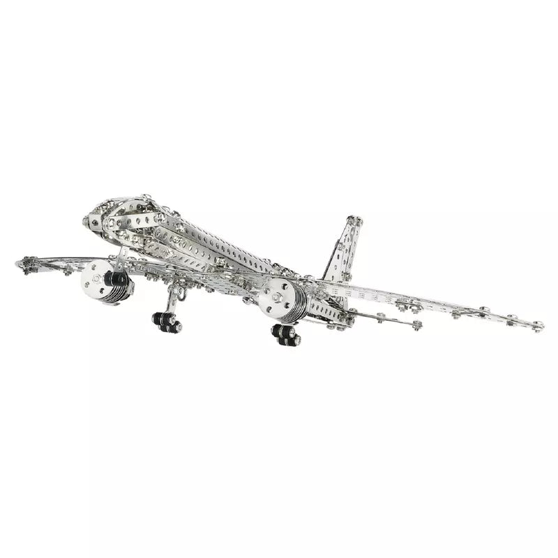 A Eitech Construction Aircraft, made from a metal Model Building kit, gracefully soaring through the air.