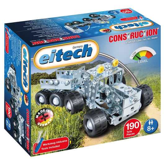 The image showcases a box of the Eitech Construction Tractor and Trailer kit, featuring a metallic toy tractor with a trailer, complete with large black wheels. The kit includes 190 pieces and tools, perfect for mechanics and construction projects. It is labeled for ages 8 and up and proudly highlights being "Made in Germany.