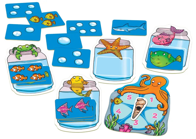 Introducing the Orchard Toys Catch & Count Game, a vibrant counting game with playful cartoon sea creatures. This set contains cards showcasing images of fish, bubbles, and a shark, in addition to jars and a spinner featuring a starfish, octopus, frog, and fish.