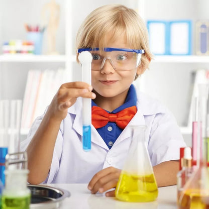 A boy in a lab coat holding a test tube, conducting Sentosphere Chemistry of Effervescence experiments.