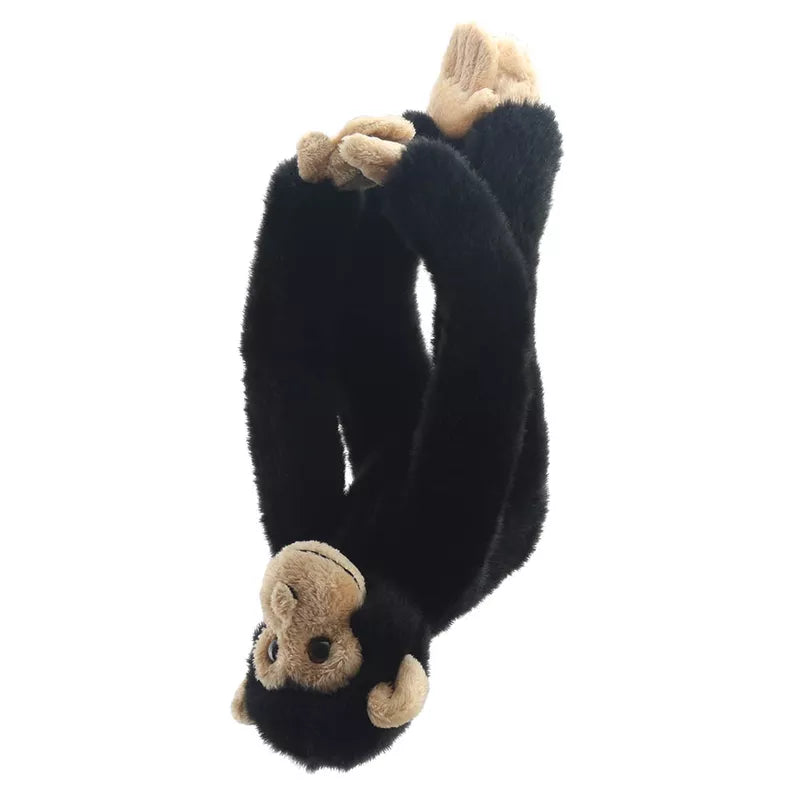 Plush Chimp Canopy Climber toy in a hanging position with velcro hands connected, isolated on a white background.
Product Name: Chimp Canopy Climber