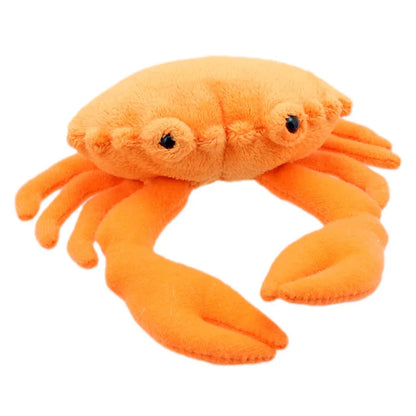 Introducing The Puppet Company Crab Finger Puppet, a soft and plush orange crab with big eyes, six legs, and two claws crafted from fuzzy fabric. Designed in a simple and cute style, this charming creation features stitched details for added texture.