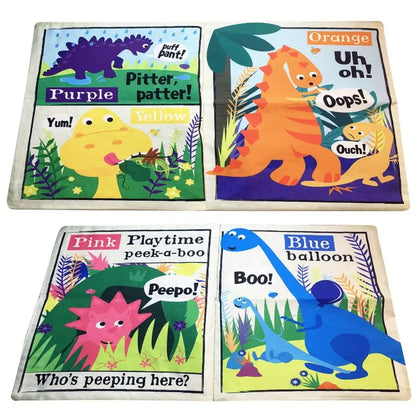 The Crinkly Cloth Book Rainbow Dinosaurs features four colorful, crinkly pages with playful cartoon dinos and labels: "Purple," "Yellow," "Orange," and "Blue"—a fun sensory book perfect for little hands.
