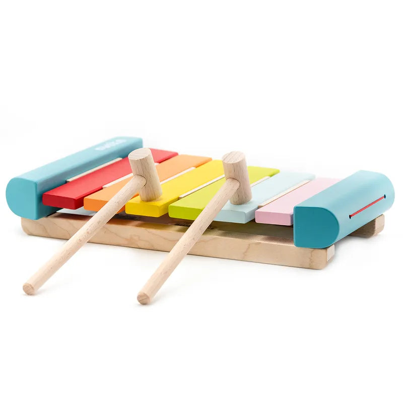 The Cubika Wooden Xylophone features a wooden base with metal keys in pastel shades and includes two wooden mallets, making it perfect for toddlers to explore sounds.