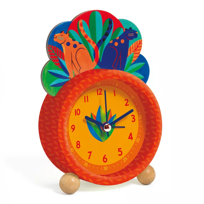 An orange clock with a colorful design on it.