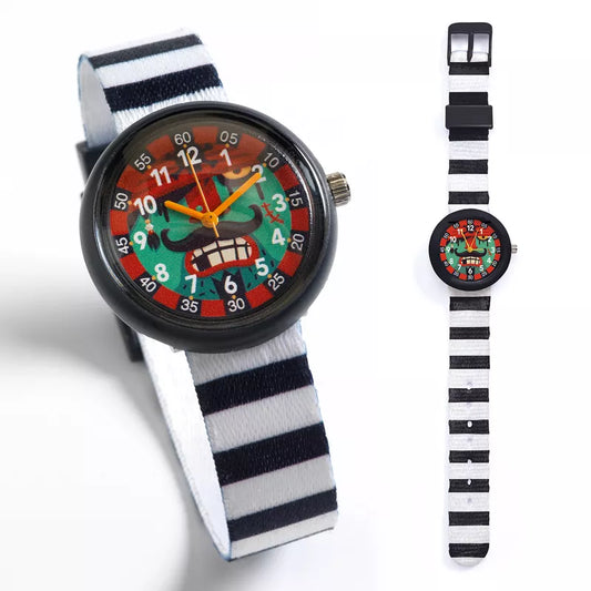 A Djeco Watch Pirate with a face on it next to a watch band.