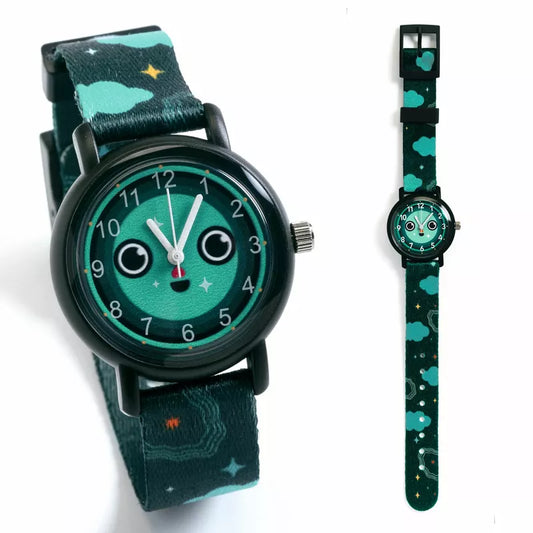 A Djeco Watch Night with a face on it next to a watch strap.