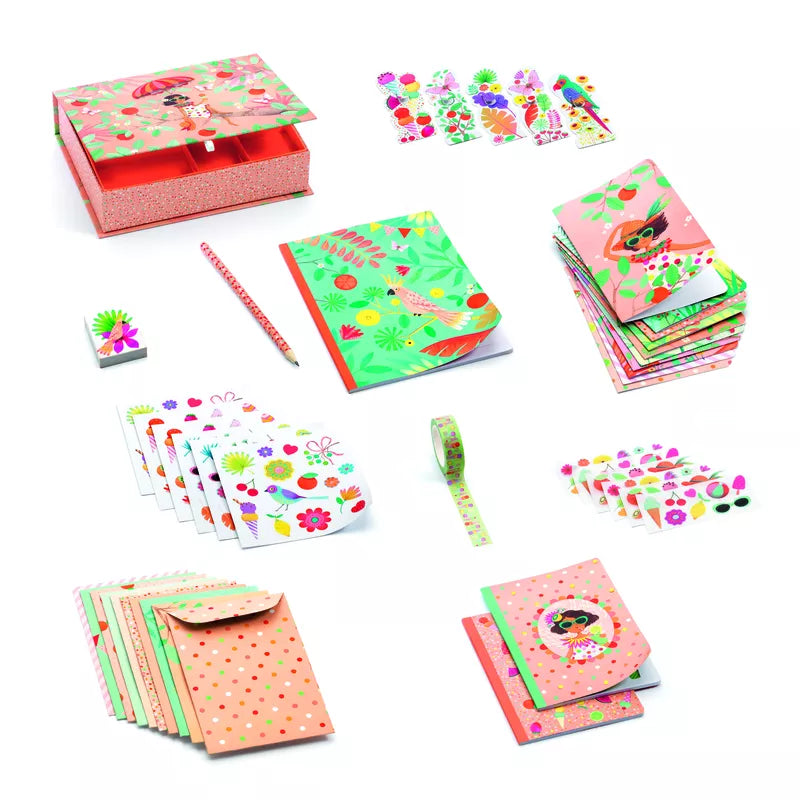 A vibrant pink and green Djeco Correspondence Marie Box Set, featuring a plethora of stickers and illustrations.