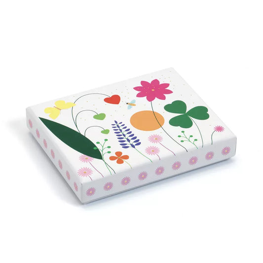 A Djeco Correspondence Emma Writing Set with illustrations of flowers and hearts on it.