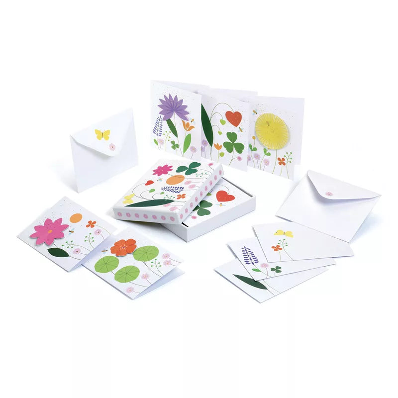 A set of Djeco Correspondence Emma Writing Set cards with illustrations of flowers and butterflies on them.