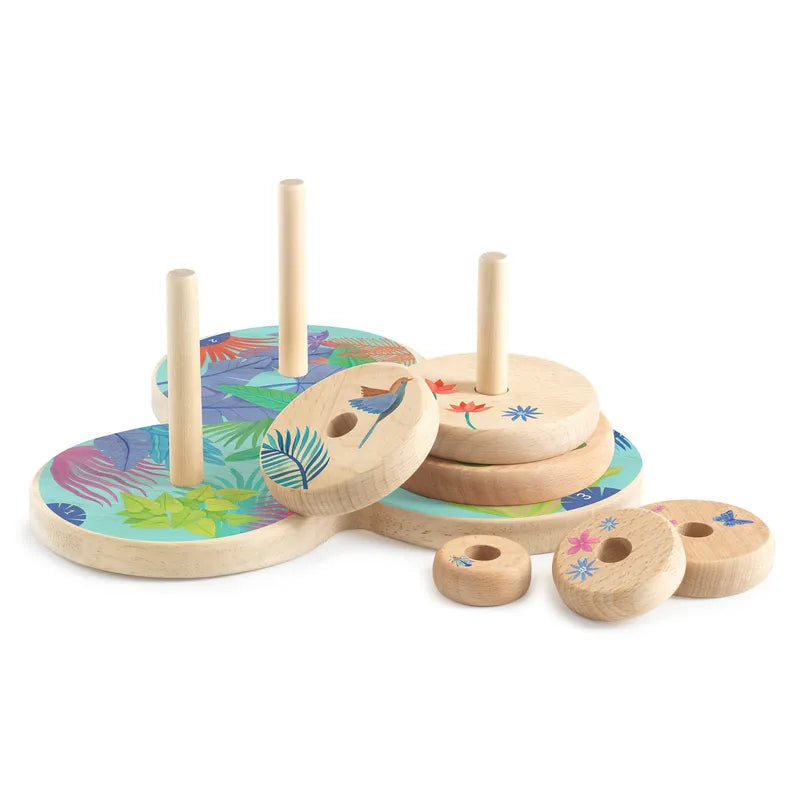 The Djeco Sologic Tour d'Hanoï is a classic wooden stacking toy with pegs and discs adorned in vibrant tropical designs, such as leaves and birds. The discs come in different sizes, helping children develop patience and logic as they stack and rearrange them creatively.