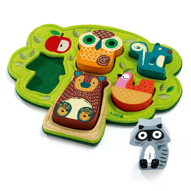 A Djeco Relief Puzzle Oski play mat with a racoon and a toy racoon.