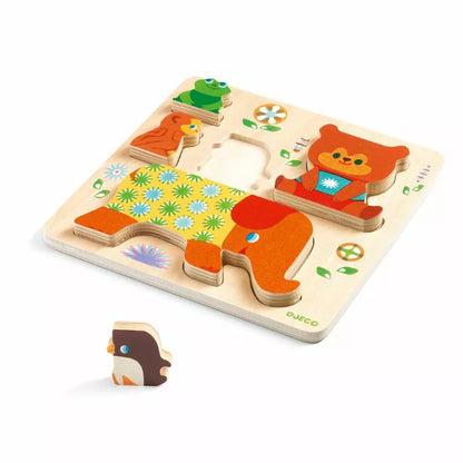 A Djeco Woodypile wooden puzzle with a bear on it.