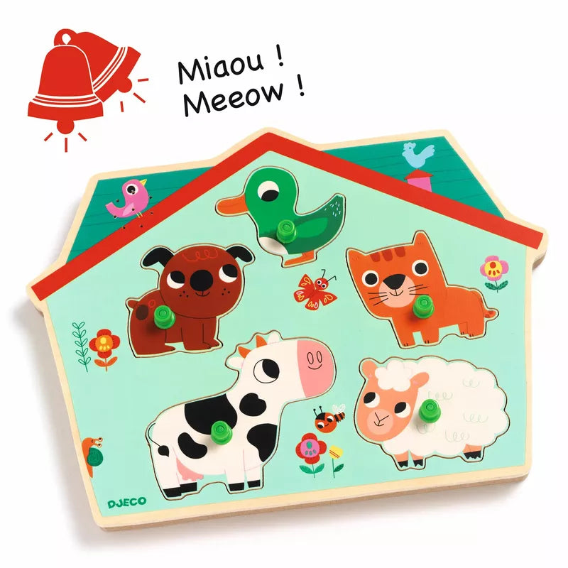 A close up of a Djeco Ouaf Woof Sound Puzzle, a wooden toy house with animals on it.