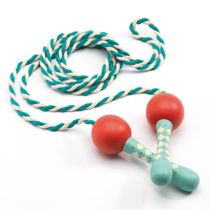 A Djeco Skipping Rope Cordelia designed for outdoor play with two wooden balls on a rope.