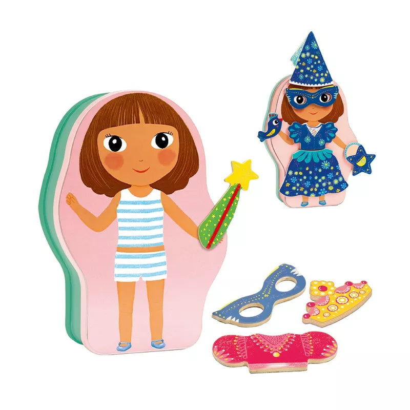 A little girl holding a Djeco Wooden Magnetic Inzebox Belissimo wand and some Djeco toys.