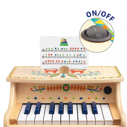 A Djeco Animambo Electronic Piano with a hat on top of it.