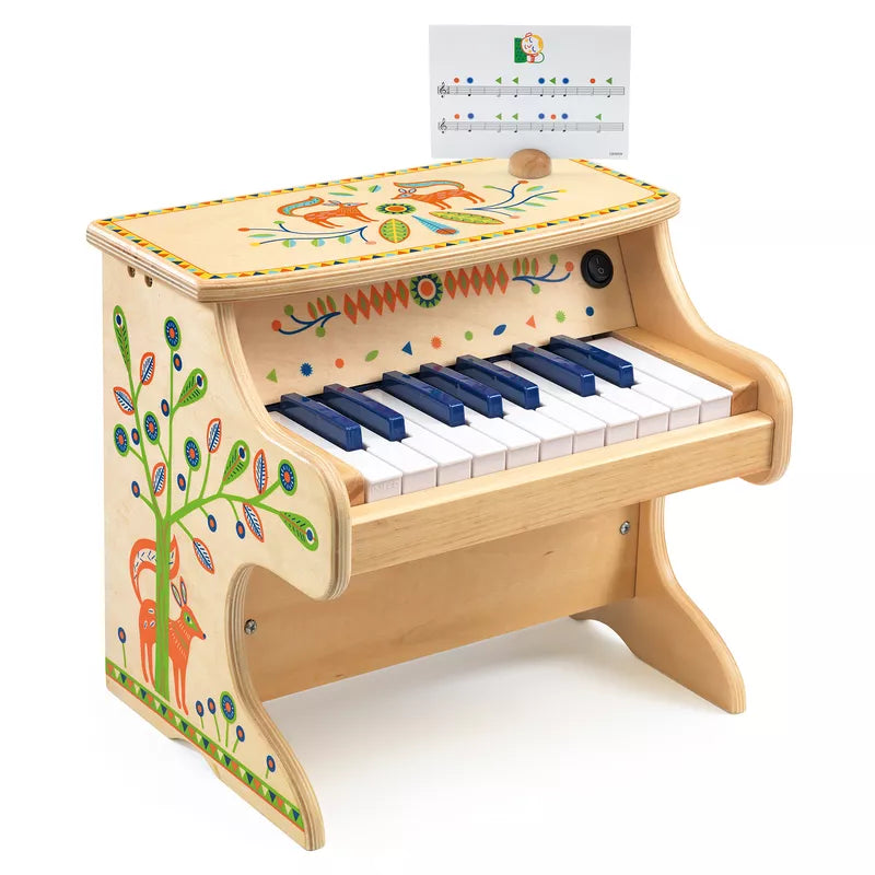 A Djeco Animambo Electronic Piano with a note on top of it.