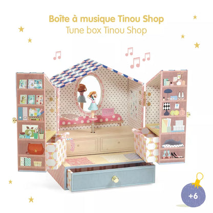 A Djeco Musical Box Tinou shop with a mirror and furniture inside of it by Djeco.