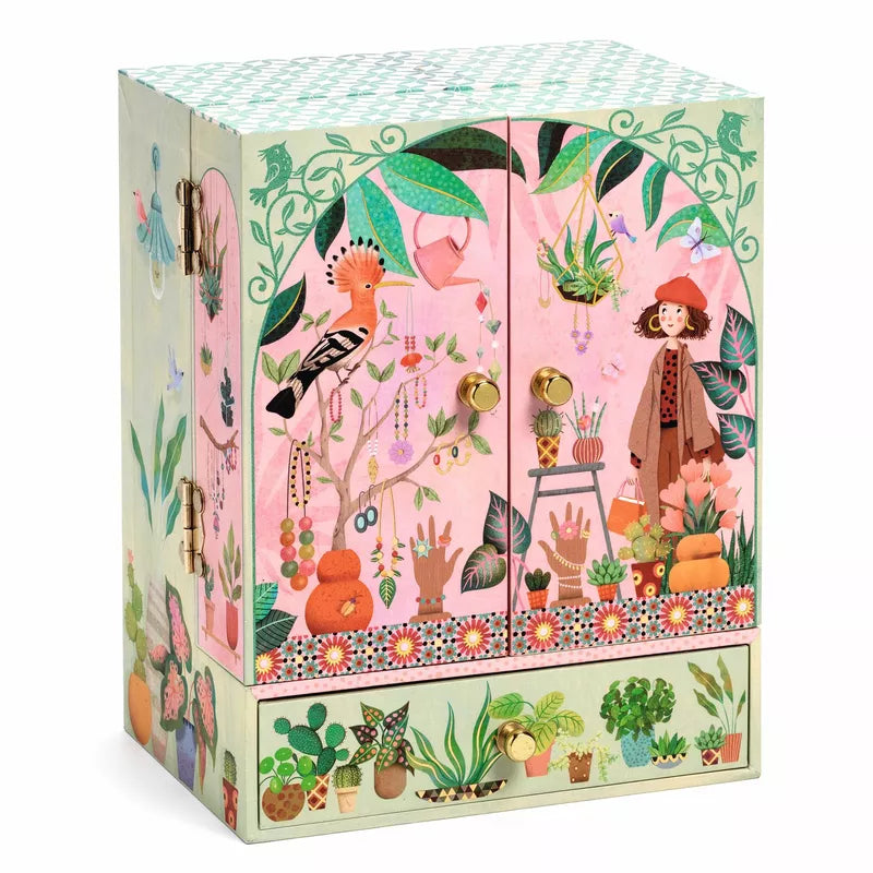 A Djeco Music Box Secret Garden with a painting on it.