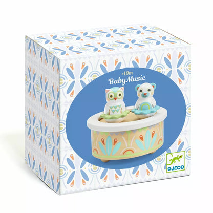 A Djeco box with a BabyMusic owl figurine sitting on top of it.