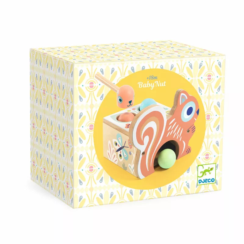 A wooden Djeco BabyNut-shaped box with a pastel-colored toy and a hammering game.