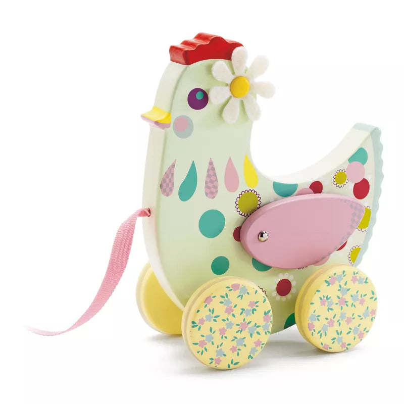 A Djeco pull along Cotcotte toy horse with a flower on its head.