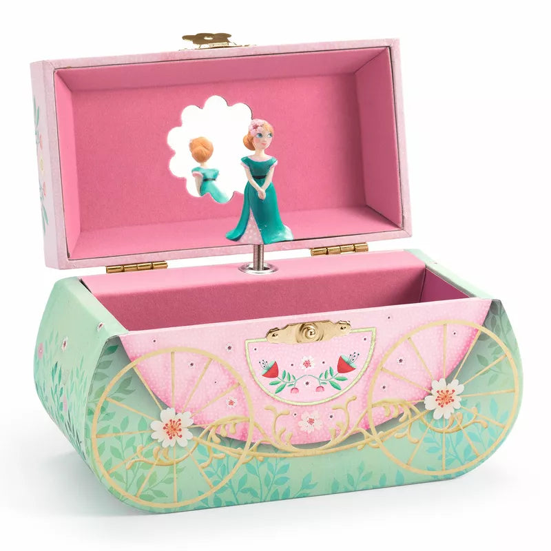 A pink and green Djeco box with a Djeco Musical Box Carriage ride doll in it.