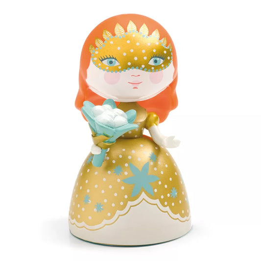 A Princess Djeco Arty Toys Barbara figurine, dressed in a stunning gold dress and gracefully holding a beautiful flower.