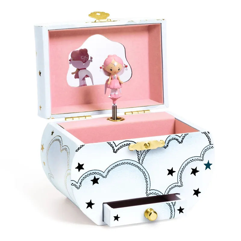 Introducing the Djeco Musical Box Elfe's Song: a white jewelry box adorned with black and gold star patterns, featuring a delightful pink interior. Open the lid to reveal an enchanting Elfe figurine and a mirror. Complete with a small drawer at the base, this piece offers charming and whimsical jewelry storage.