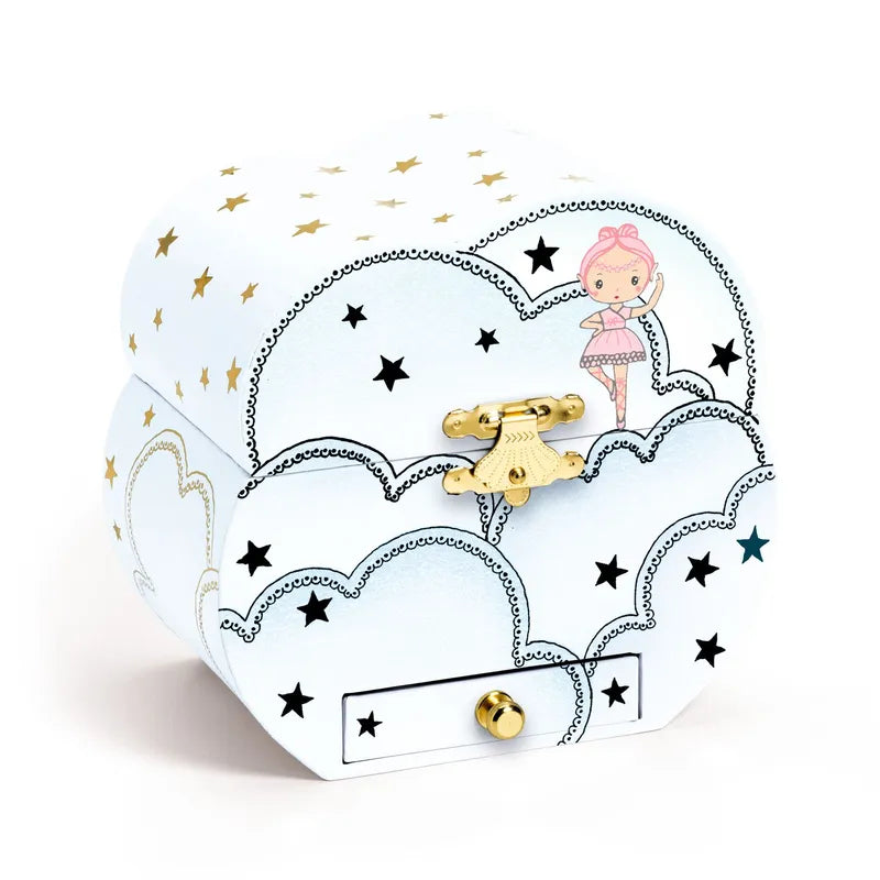 Introducing the Djeco Musical Box Elfe's Song: a whimsical music box with a curved design, adorned with golden and black stars as well as cloud patterns. A small ballerina illustration graces the top right corner. Complete with a golden latch and a front drawer featuring a convenient knob, this enchanting piece makes for perfect jewellery storage.