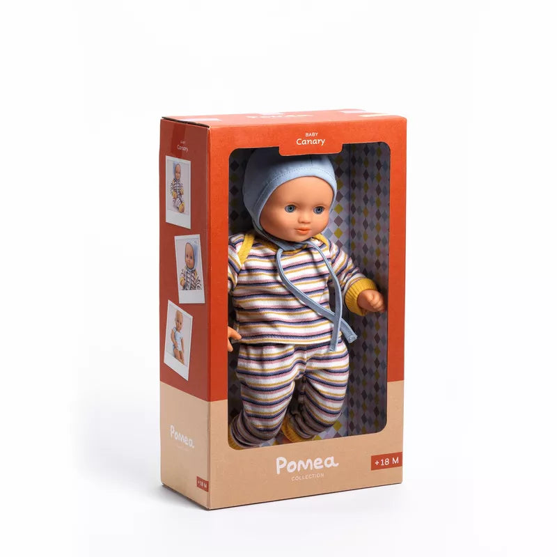A Djeco Baby Canary Baby Doll in a box on a white background.