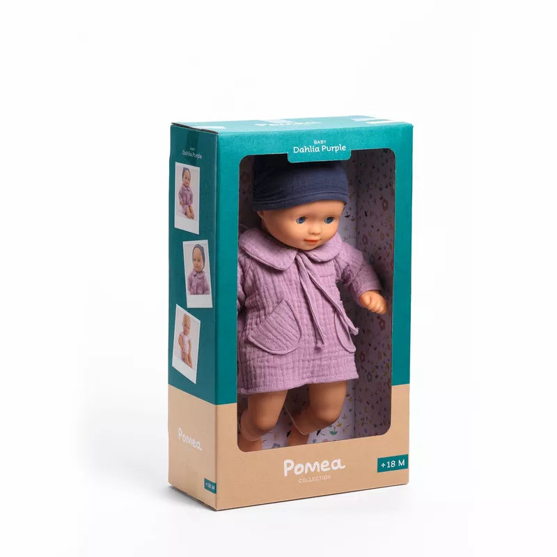 A Djeco Baby Dahlia Purple Baby Doll in a box on a white background.