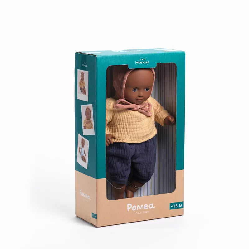 A Djeco Baby Mimosa Baby Doll in a box on a white background.