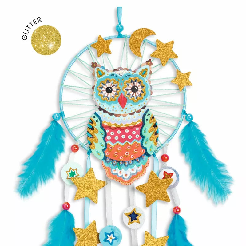A decorative Djeco Create Golden Owl with stars and feathers.