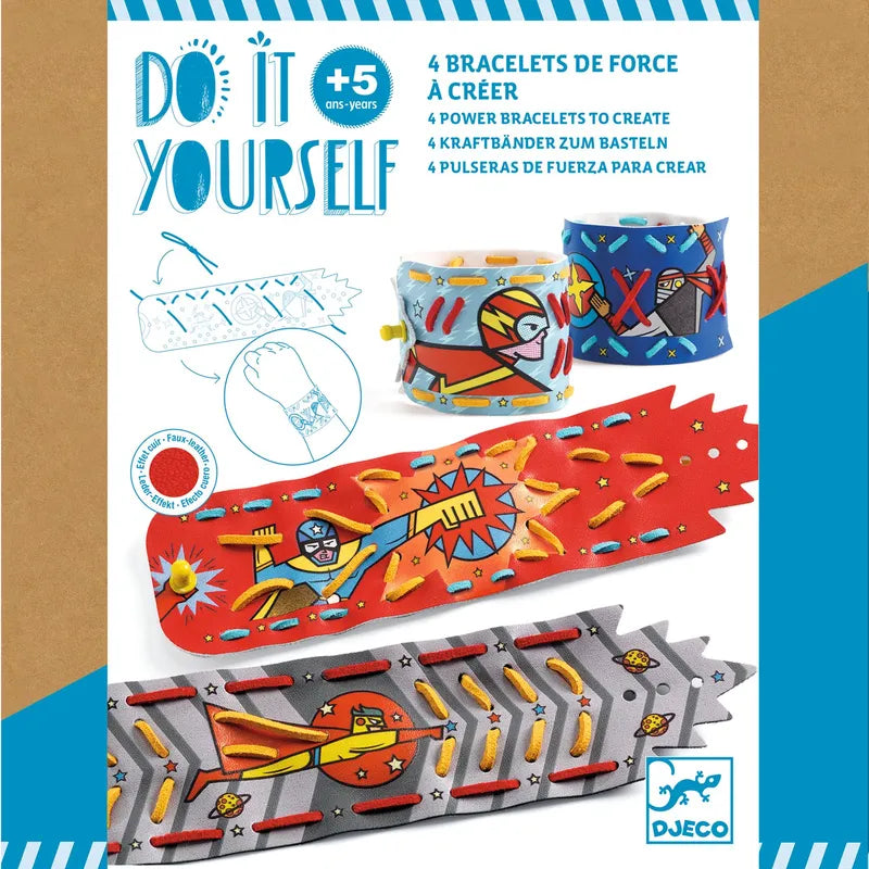 A product image showcases the Djeco Mosaics & Stickers Super-Powers - Fsc Mix, a creative kit for children aged 5 and older. The superhero bracelet kit includes four vibrant templates featuring bright colors, lightning bolts, and action scenes. The box cover displays instructions in multiple languages along with the Djeco brand logo.