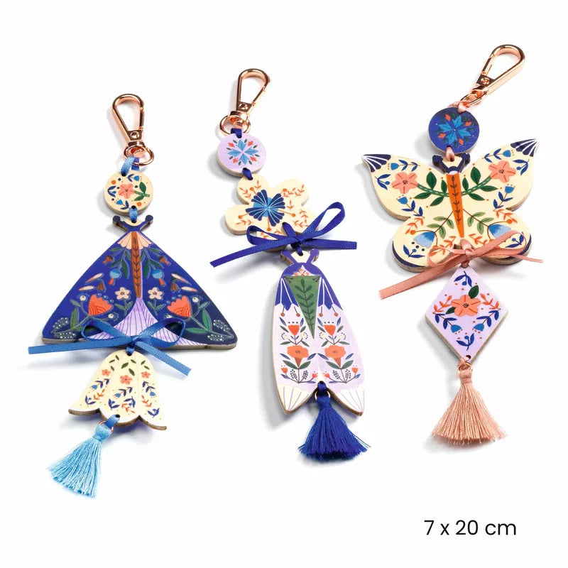 Three Djeco Create Butterflies keychains with butterflies, tassels, and wooden charms.
